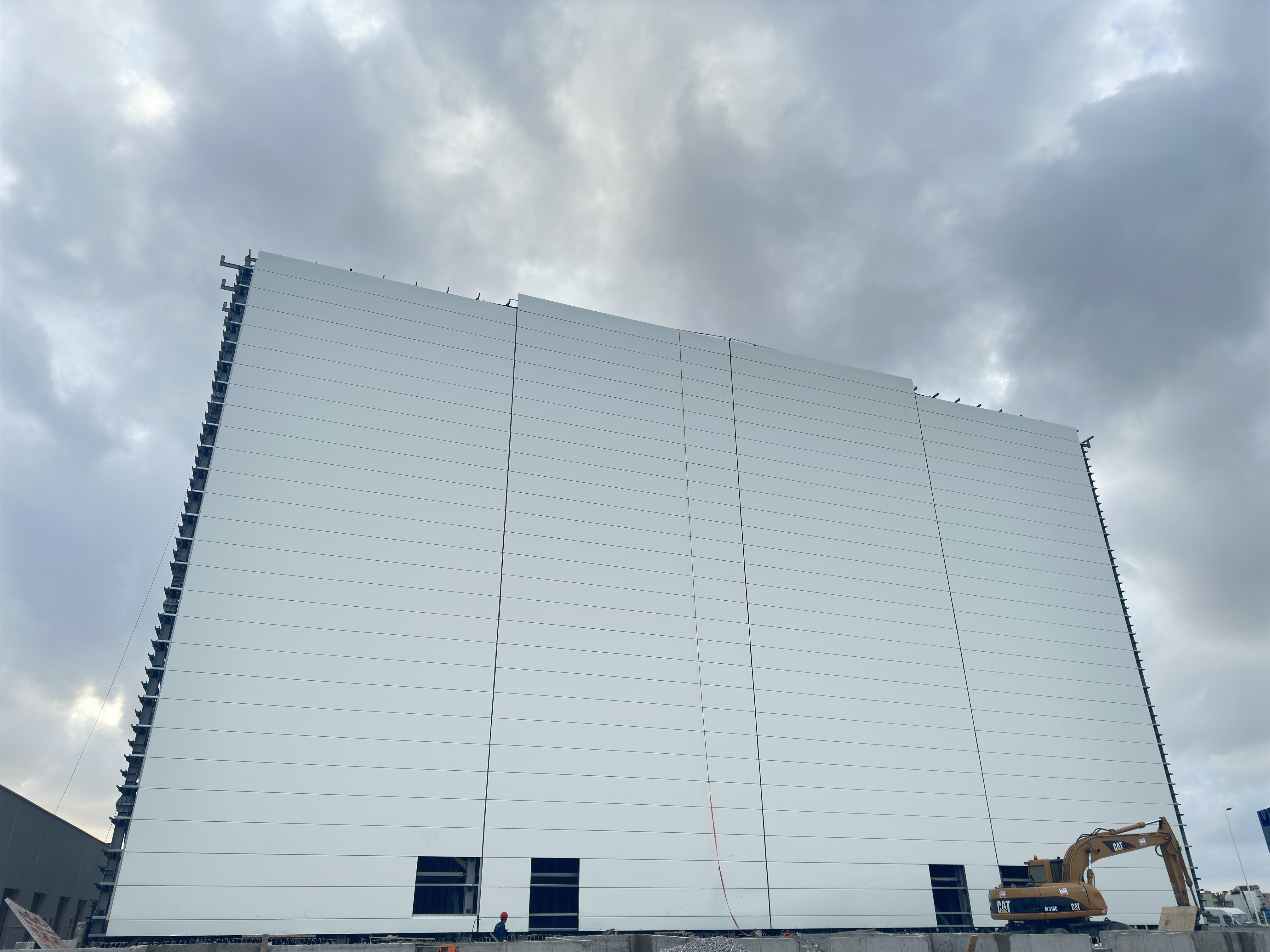Rack-supported warehouse with high-bay storage and ASRS automation